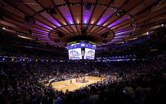 Players battle for the ball at the opening tip-off between the Marquette Golden Eagles and the Connecticut Huskies at Madison Square Garden March 16 in New York City. (OSV News/USA TODAY Sports via Reuters/Brad Penner)