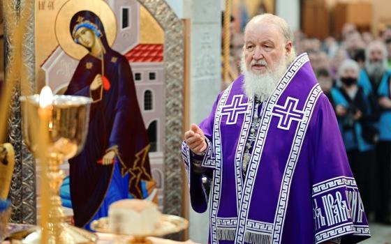 Russian Patriarch Krill, vested before Eucharistic elements on altar. 
