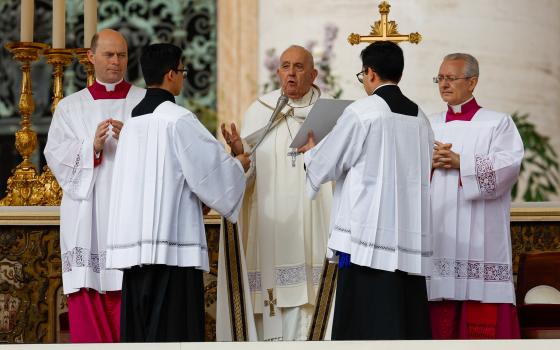Pope Francis prays as he begins Easter morning Mass in St. Peter's Square at the Vatican March 31, 2024. (CNS photo/Lola Gomez)