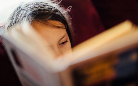 Child reading a book