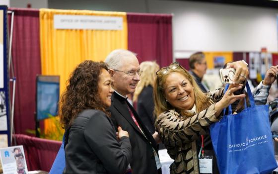 Attendees take a selfie with Los Angeles Archbishop José Gomez Feb. 16 during the 68th Los Angeles Religious Education Congress at the Anaheim Convention Center.