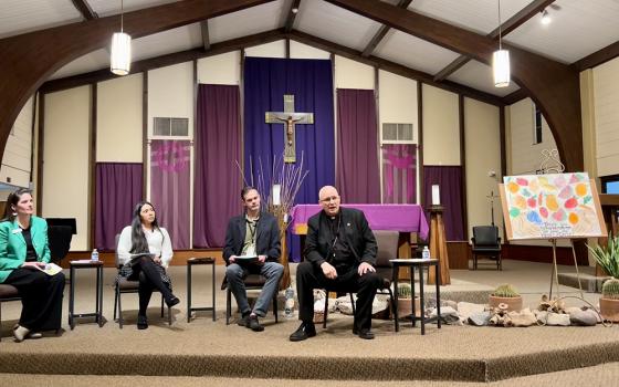 From left: Ellen Fisher, assistant director of the Catholic University of American in Tucson, Gabrielle Cardenas, a Catholic from South Tucson, Brian Eller, public health official for Pima County, and Tucson Bishop Edward Weisenburger take part in a March 18 event on air pollution at the University of Arizona in Tucson. (Courtesy of Bishop Edward Weisenburger)