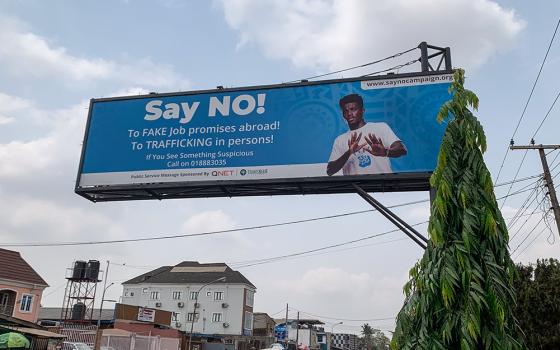 An anti-human trafficking billboard in Lagos, Nigeria, warns the public about fake job offers used by traffickers to lure members of the public into human trafficking. (Valentine Benjamin)