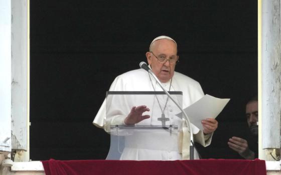 Pope Francis reads his message during the Angelus noon prayer from the window of his studio overlooking St. Peter's Square, at the Vatican, Sunday, March 10, 2024. 