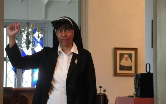 Sister Mary Roger Thibodeaux with fist raised