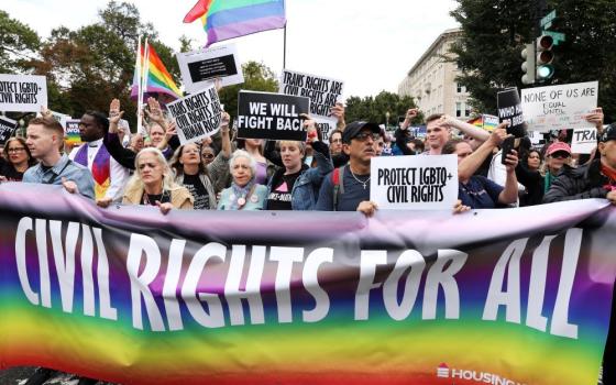 LGBTQ activists and supporters block the street outside the U.S. Supreme Court Oct. 8, 2019, as it hears arguments in a major case on workplace discrimination and gay and transgender employees. 