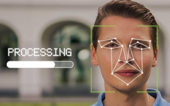 Man's face on a computer screen, with lines representing biometric screening