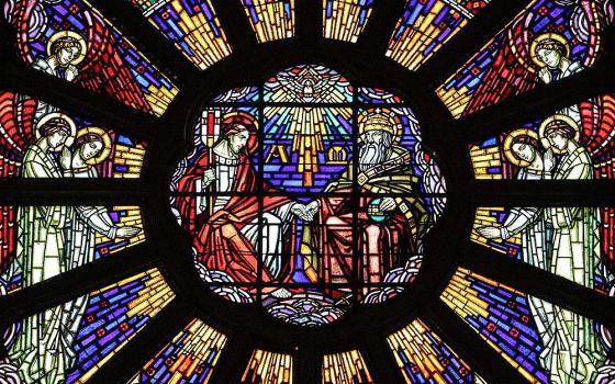 Stained glass depicts the Trinity (Wikimedia Commons/Lepocheux)