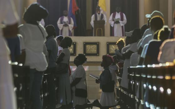 essay about my experience with god in a sacred place People kneel at pews and in aisle of church