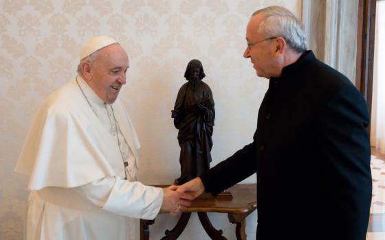 Pope Francis greets then-Jesuit Fr. Marko Rupnik during a private audience at the Vatican in this Jan. 3, 2022, file photo. 