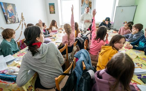 Sr. Lydia Timkova of the Dominican Sisters of Blessed Imelda teaches a catechism class in Mukachevo, Ukraine, in February 2023. The image's photographer, Gregg Brekke, worked with GSR international correspondent Chris Herlinger in reporting on much of the Ukraine portion of the series "Hope Amid Turmoil: Sisters in Conflict Areas." He also won two awards of excellence for his photography, including work that appeared in GSR. 