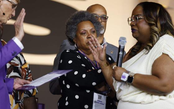 April Verrett, right, receives an SEIU presidential oath from Emeritus Mary Kay Henry in downtown Philadelphia on May 19, 2024. (Verrett/X)