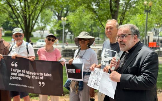 Bishop John Stowe of Lexington, Kentucky speaks to demonstraters