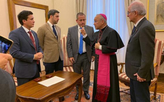 Monsignor Pena Parra speaks to delegation