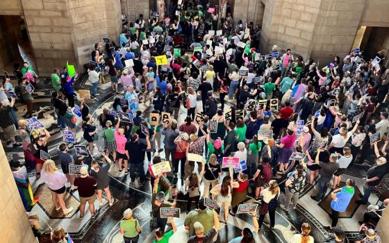 Hundreds of people gather at the Nebraska Capitol to protest against a proposed abortion ban, in Lincoln, on May 16, 2023. Millions of dollars in last-minute money is pouring into the battle over a pair of abortion-related ballot measures in Nebraska. One seeks to block abortion rights; the other would enshrine abortion rights within the state constitution. (AP/Margery Beck, file) 