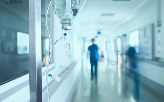 Medical workers walk in a hospital hallway in an illustration photo. (Dreamstime/Sudok1)