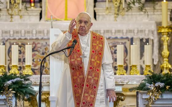 Pope Francis gives his blessing after praying the Angelus with local bishops, priests, deacons, consecrated persons and seminarians at the Cathedral of Our Lady of the Assumption in Ajaccio, France, Dec. 15. (CNS/Lola Gomez)
