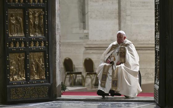 Pope Francis opens the Holy Door of St Peter's Basilica to mark the start of the Catholic Jubilee Year, at the Vatican, Dec. 24, 2024. (Alberto Pizzoli/Pool Photo via AP) 			