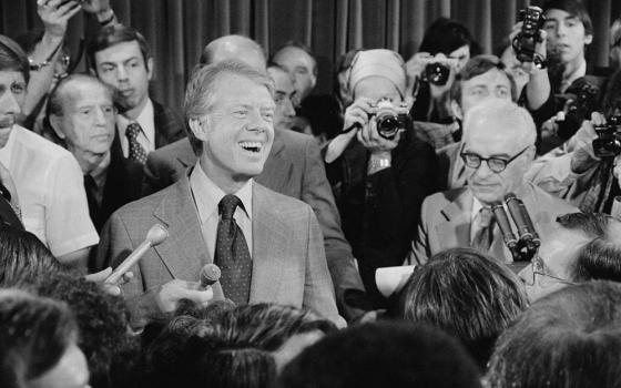 President Jimmy Carter attends a press conference, surrounded by journalists, June 13, 1977. (Library of Congress/Thomas J. O'Halloran/Handout via Reuters/file photo)
