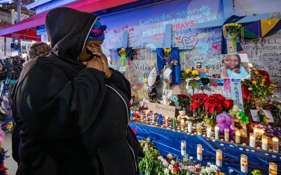 Courtney Polk, cousin of LaTasha Polk, who was killed in the New Year's Day attack, reacts at a memorial on Bourbon Street and Canal Street in New Orleans Jan. 4, 2025, (AP/Matthew Hinton)