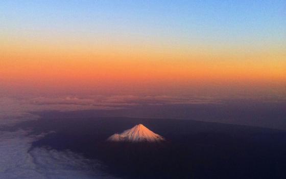 Aerial view of mountain in sunset.