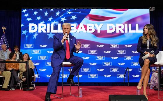 Then-candidate President Donald Trump speaks at a campaign town hall at the Greater Philadelphia Expo Center & Fairgrounds, Oct. 14, 2024, in Oaks, Pa., as moderator South Dakota Gov. Kristi Noem listens. (AP/Alex Brandon, File)