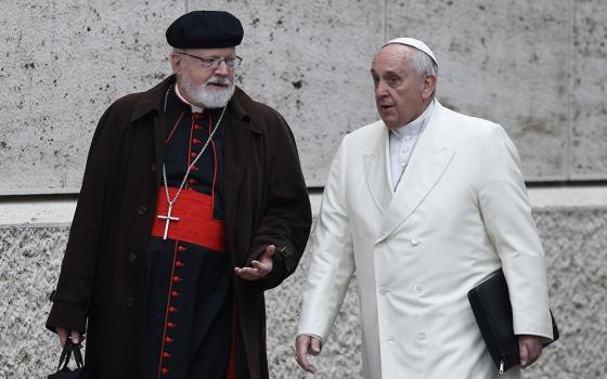 Pope Francis talks with Cardinal Sean O'Malley of Boston as they arrive for a meeting in the synod hall at the Vatican Feb. 13, 2015. O'Malley delivered a lecture, part of the Bergoglio Lecture Series, Feb. 26 at Sacred Heart University. (CNS/Paul Haring)