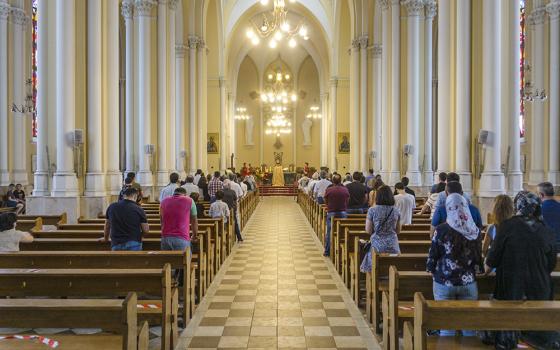 Parishioners pray at the Catholic Cathedral of the Immaculate Conception of the Holy Virgin Mary in Moscow in an undated photo. (Dreamstime/Uladzimir Zuyeu)