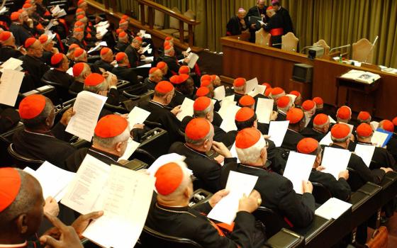 Cardinals gather in the Vatican's synod hall April 7, 2005, a day before the funeral of Pope John Paul II. (CNS/L'Osservatore Romano)