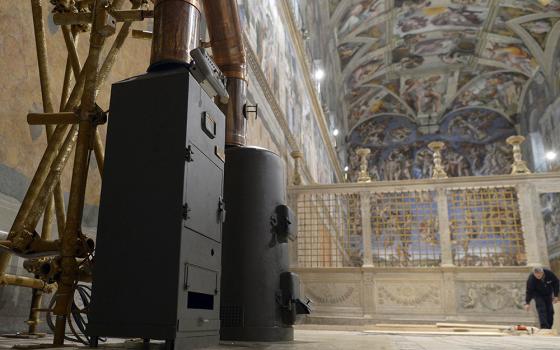 Stoves used to burn ballots during a papal conclave are seen in the Vatican's Sistine Chapel March 8, 2013. (CNS/L'Osservatore Romano) 