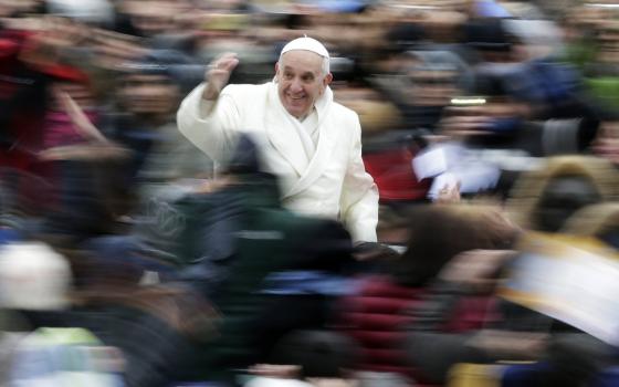 Pope Francis waves as he arrives for his weekly audience in St. Peter's Square at the Vatican Nov. 27. (CNS/Reuters/Max Rossi)