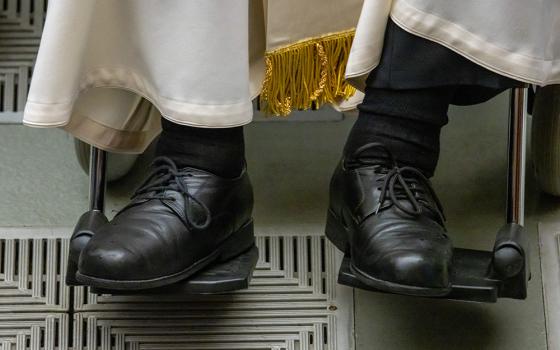 Pope Francis' shoes are seen in a photo as he greets visitors during his weekly general audience in the Paul VI Audience Hall at the Vatican May 1, 2024. (CNS/Pablo Esparza)