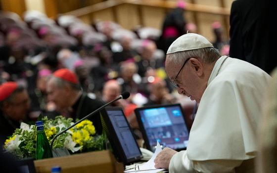 Pope Francis reviews papers Feb. 23, 2019, the third day of a meeting on the protection of minors in the church at the Vatican. (CNS/Vatican Media)