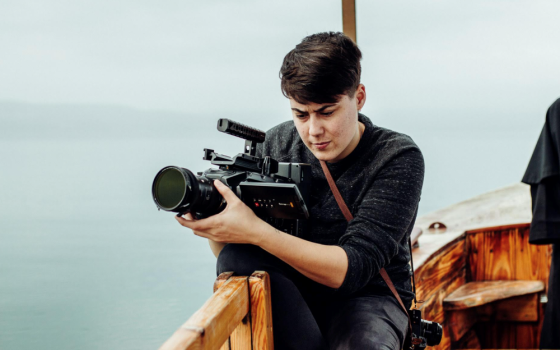 Maxwell Kuzma films while on boat. 
