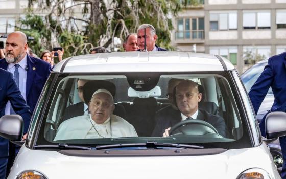 Francis in front seat of car