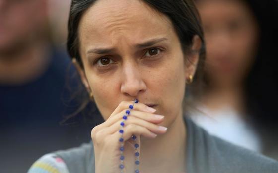 woman with rosary