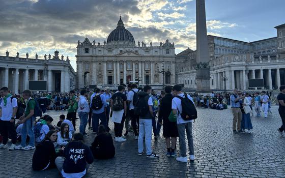 Youth gather in St. Peter's Square the evening of April 26, hours after hundreds of thousands of Catholics, leaders and diplomats crammed into St. Peter's Square to mourn the death of Pope Francis. (NCR photo/Olivia Bardo)
