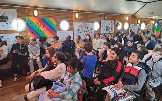 Youths gather for a lesson on peacemaking led by Pax Christi France in May 2023. (Courtesy of Pax Christi France)