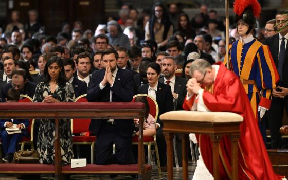 JD Vance attends the Good Friday mass in St. Peter's Basilica at the Vatican, Friday, April 18, 2025. (Kenny Holston/The New York Times via AP, Pool)