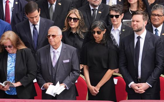 U.S. Vice President JD Vance, right, and second lady Usha Vance stand next to Louis Prevost, brother of Pope Leo XIV, and his wife, Deborah, left, at the inauguration Mass of the new pope's pontificate in St. Peter's Square at the Vatican May 18, 2025. U.S. President Donald Trump and Vance met Louis and Deborah Prevost at the White House May 20. (OSV News/Jacquelyn Martin, pool via Reuters)