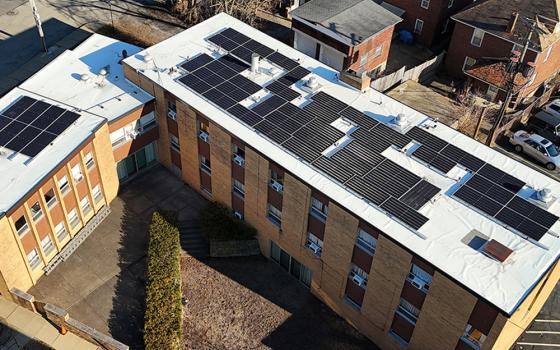 Solar panels are seen on the roof of St. Catherine of Siena Church's rectory buildings in Pittsburgh. More than 170 panels were installed on the roofs of the school, church and rectory buildings. Installation was completed March 4. (Theresa Doerfler)