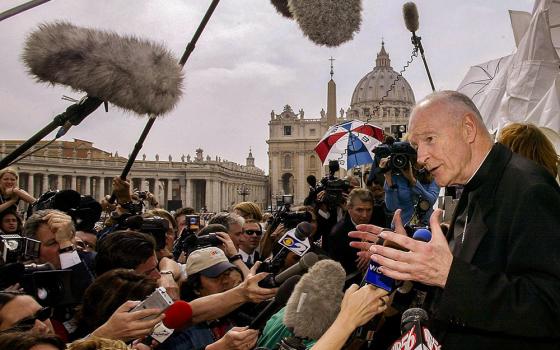 Then-Cardinal Theodore McCarrick of Washington faces the press in the shadow of St. Peter's Basilica at the Vatican April 24, 2002. U.S. cardinals were meeting for a summit with Pope John Paul II at the Vatican, as the sex abuse crisis unfolded in the United States. (CNS/Reuters/Paolo Cocco)
