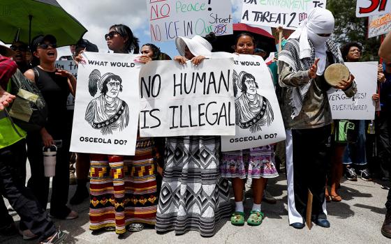Protesters flank an entrance road at a temporary migrant detention center nicknamed "Alligator Alcatraz" in Ochopee, Florida, July 1, 2025, the day U.S. President Donald Trump visited the facility. (OSV News/Reuters/Octavio Jones)