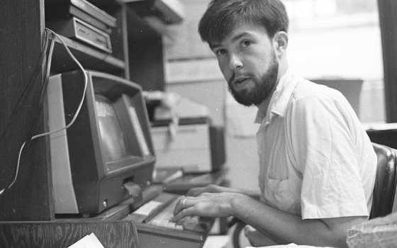 Joe Feuerherd, intern and future NCR publisher and editor, works in NCR's Washington Bureau office in 1984. (NCR photo/Steve Askin)