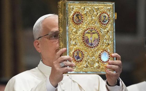 Pope Leo XIV holds the Gospel as he presides over the opening of the pastoral year of the Diocese of Rome in the Archbasilica of St. John Lateran in Rome, Sept. 19. (AP/Alessandra Tarantino)