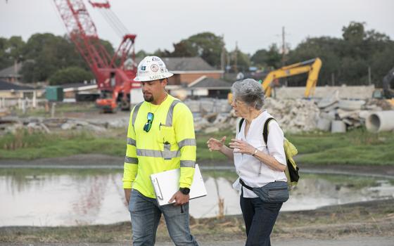 Sr. Joan Laplace speaks with a construction worker in September 2025. The Congregation of the Sisters of St. Joseph's Mirabeau Water Garden in New Orleans is under construction, and a completion date for Phase 1 is in sight. (Courtesy of the Congregation of Sisters of St. Joseph)