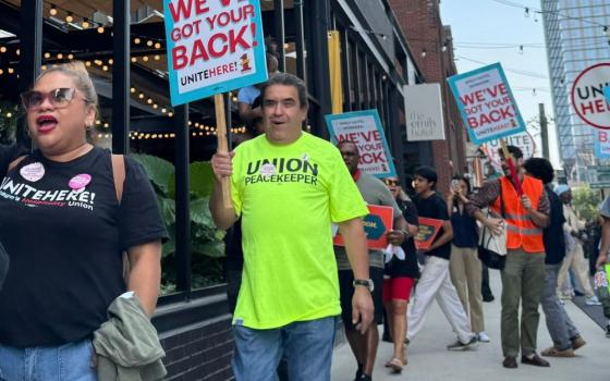 Jesus Morales walks the line with fellow hotel workers asking for a first union contract at the Emily Hotel in Chicago's West Loop this summer. Morales has worked at Chicago's Drake Hotel for nearly 40 years and serves as a vice president of the executive board of Unite Here Local 1 and a delegate to the Chicago Federation of Labor. (Courtesy of Unite Here Local 1)