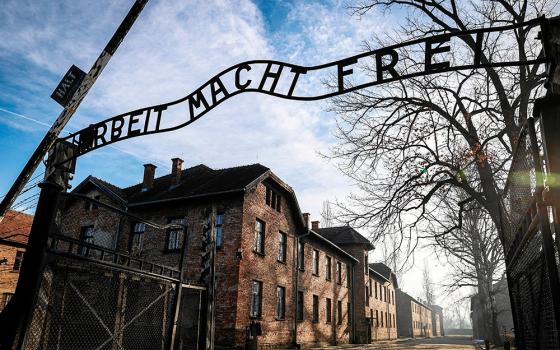 The gate that reads "Arbeit macht frei" ("Work makes you free") is seen Jan. 27, 2025, at the Nazi German Auschwitz-Birkenau concentration and extermination camp in Oswiecim, Poland. In an Oct. 31, 2025, statement, Bishop Timothy C. Senior of Harrisburg, Pennsylvania., apologized for Nazi imagery that appeared on a float presented by St. Joseph Catholic School in Hanover at the town's Halloween parade, which included a replica of the Auschwitz gate. (OSV News/Reuters/Grzegorz Celejewski)