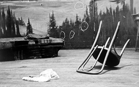 Bullet holes at the back of the stage where Malcolm X was shot are shown in a news photo from 1965. (Library of Congress/World Telegram & Sun/Stanley Wolfson)