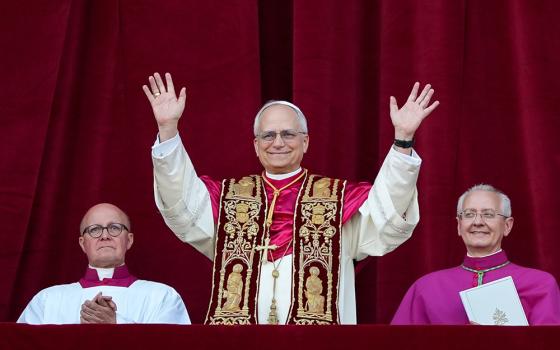 Pope Leo XIV, the former Cardinal Robert F. Prevost, waves to the crowds in St. Peter's Square at the Vatican after his election as pope May 8, 2025. (CNS/Lola Gomez)